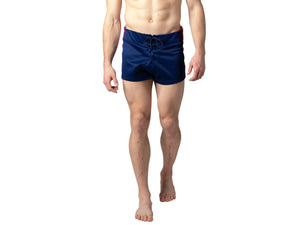 Man wearing blue BIKE® football shorts