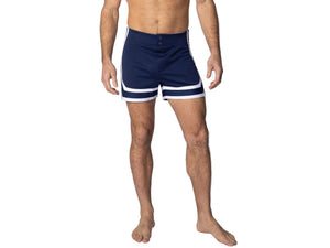  Man wearing navy BIKE® athletic stripe coaches short