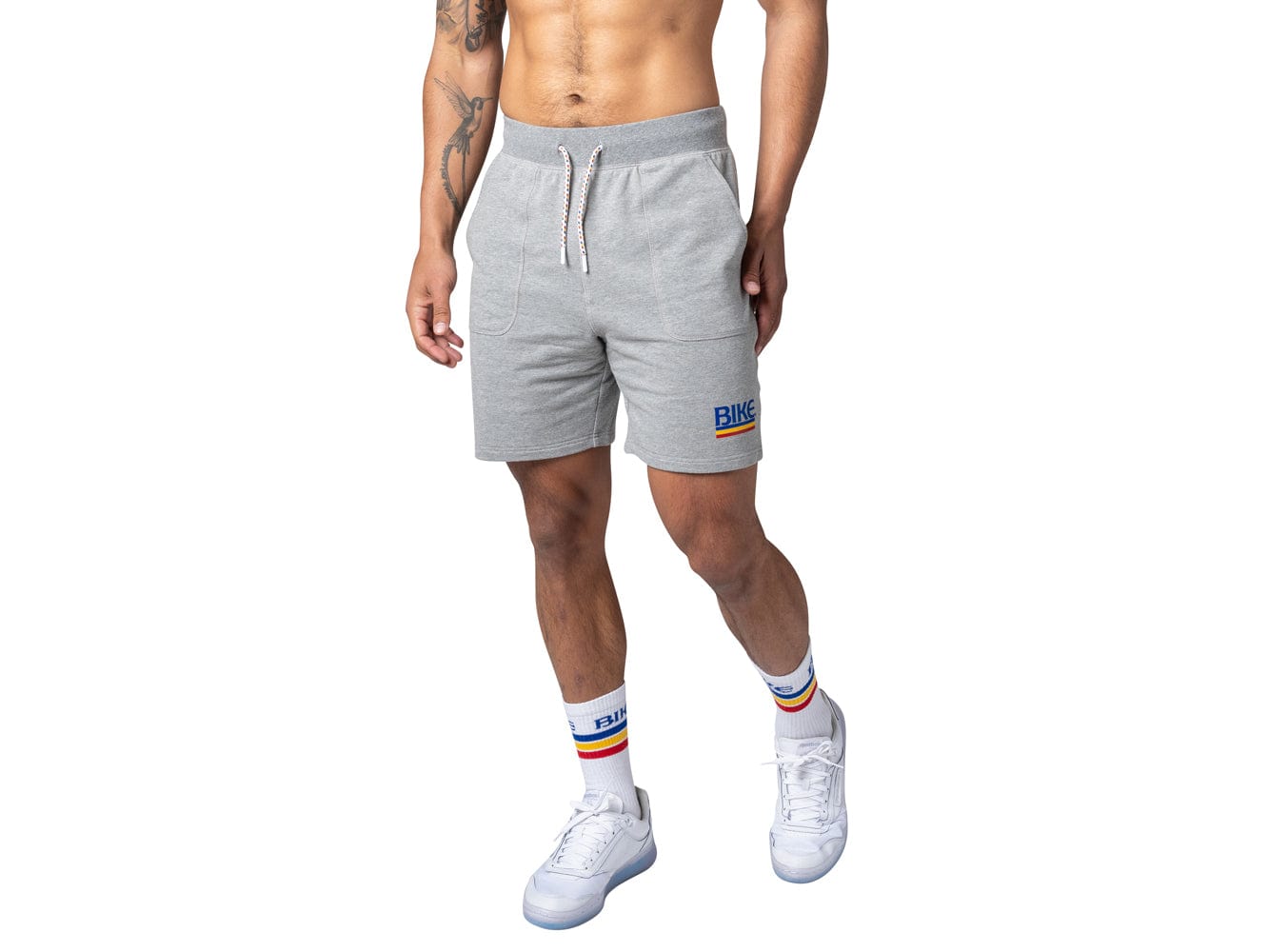 Man wearing grey BIKE® fleece shorts