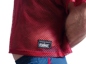 Man wearing red BIKE® mesh shirt