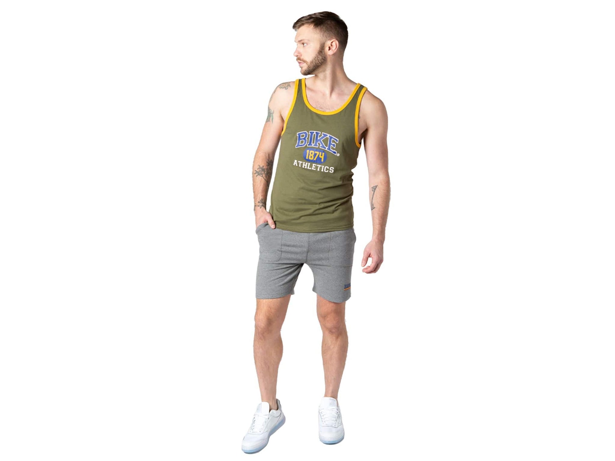Man wearing olive BIKE® logo tank top