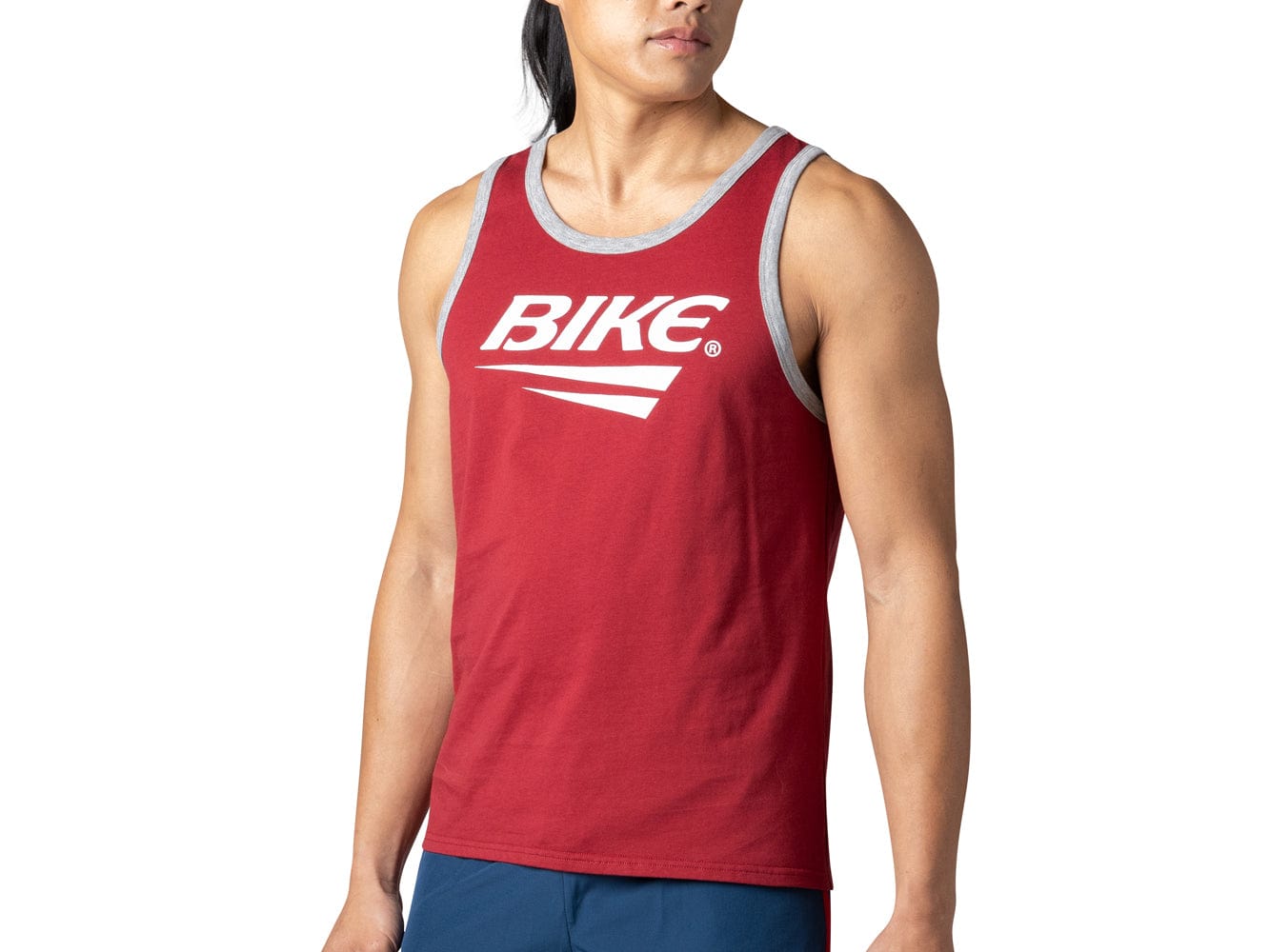 Man wearing red BIKE® logo tank top
