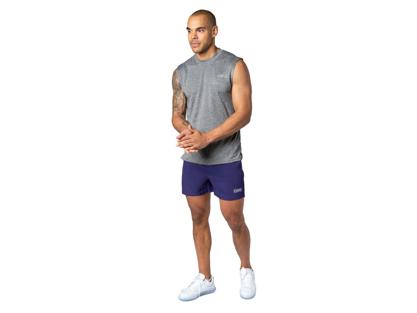 Man wearing grey sleeveless BIKE® tshirt
